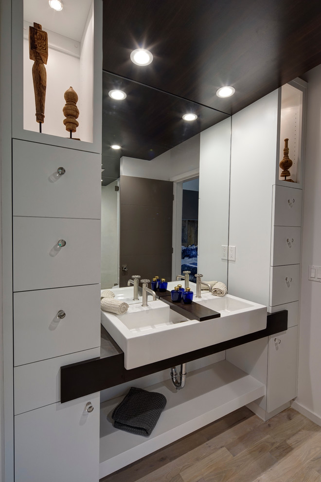 This is an example of a transitional powder room in Other.