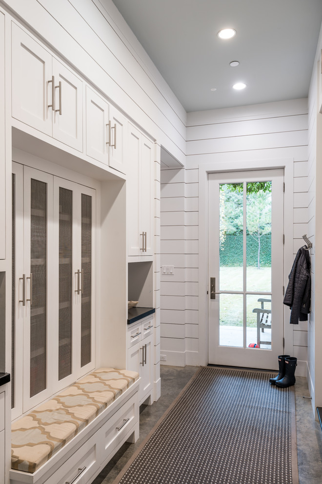 Inspiration for a country mudroom in Houston with white walls, a single front door and a glass front door.
