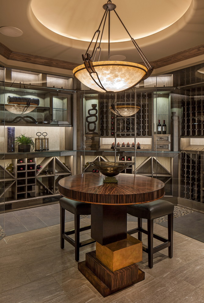 Photo of a transitional wine cellar in Omaha with storage racks and grey floor.