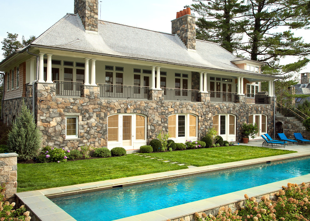 Photo of a traditional exterior in New York with stone veneer.
