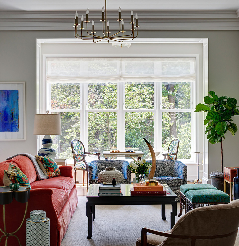 Design ideas for a transitional family room in New York with grey walls, medium hardwood floors and beige floor.