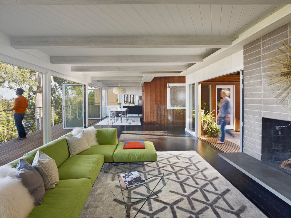 This is an example of a midcentury open concept living room in San Francisco.