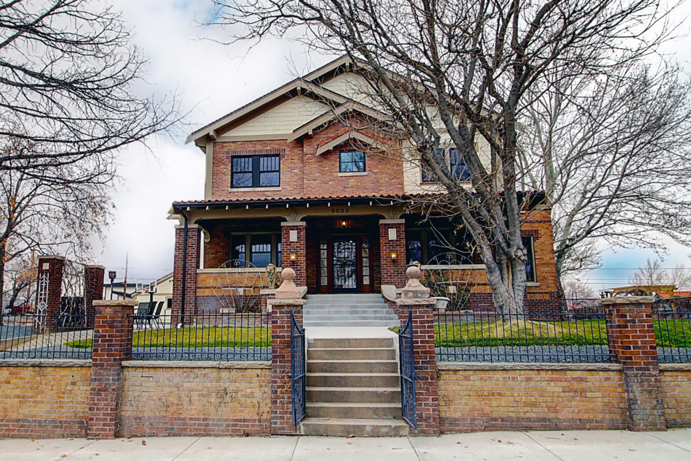 Large and red traditional brick detached house in Denver with three floors, a pitched roof, a mixed material roof, a red roof and shingles.