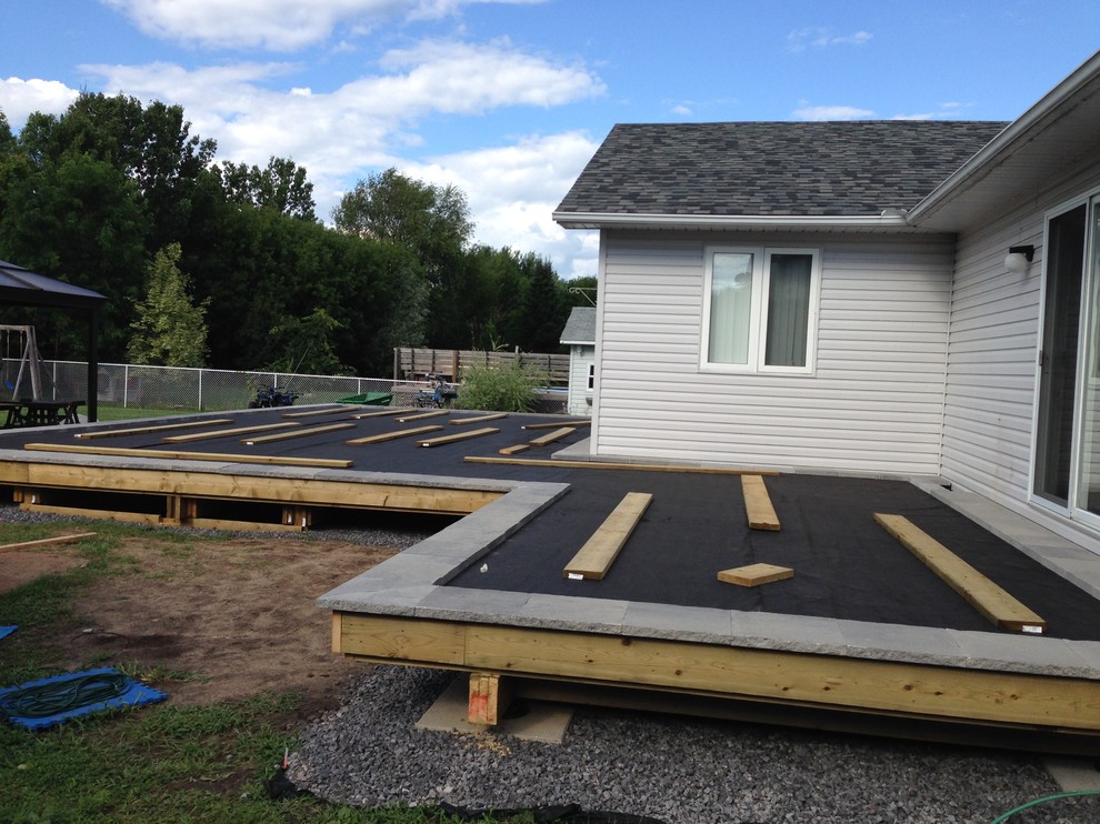 Huge transitional backyard deck photo