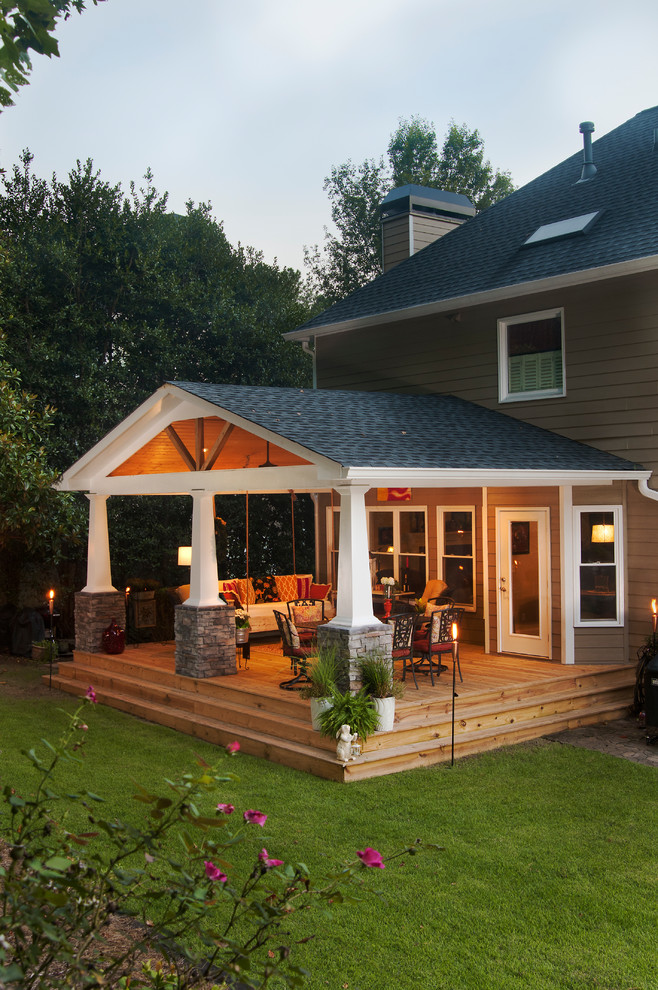 Mid-sized arts and crafts back porch idea in Atlanta with decking and a roof extension