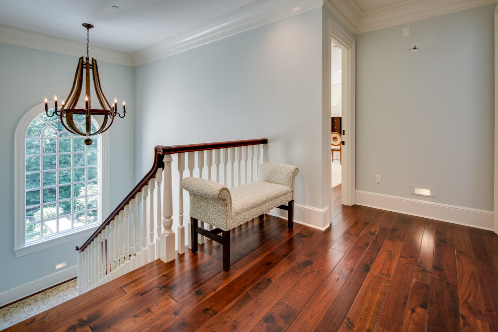 Inspiration for a large country wood u-shaped staircase in DC Metro with painted wood risers.