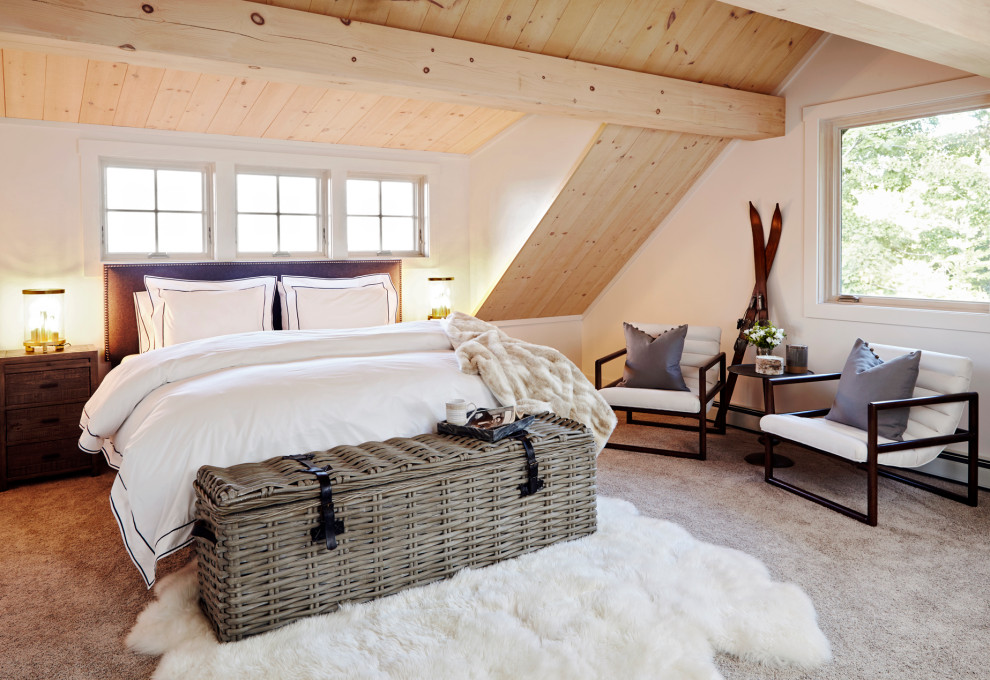 Mid-sized country bedroom in New York with white walls, carpet, grey floor, vaulted and wood walls.
