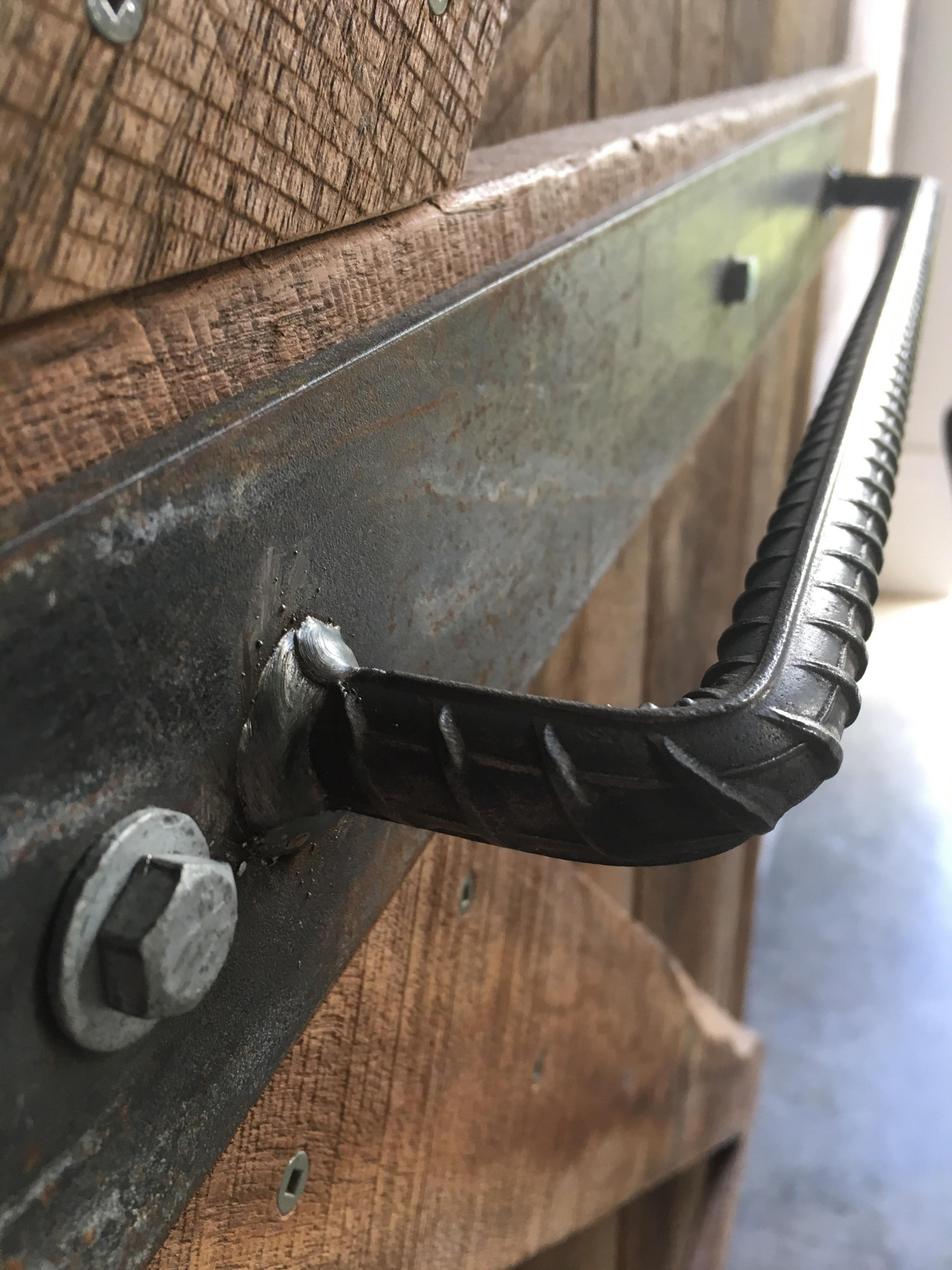 Rio Bar bent and welded to make a unique barn door handle