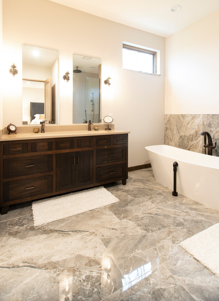 Mountain style master double-sink and wainscoting freestanding bathtub photo with shaker cabinets, an undermount sink and quartz countertops
