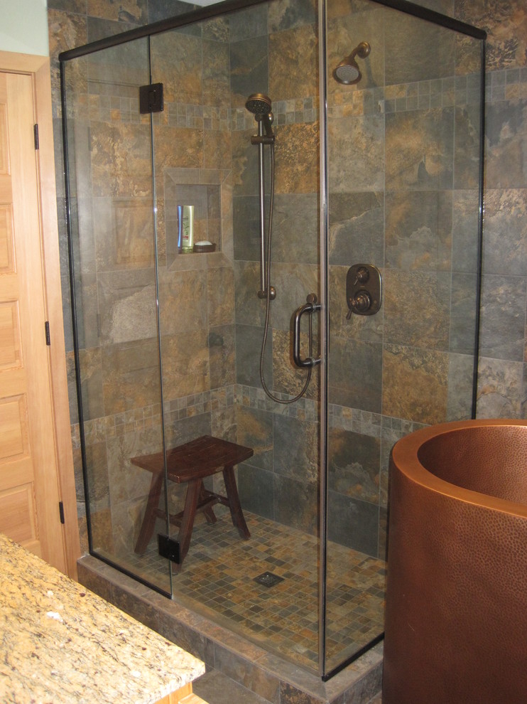 Asian 3/4 bathroom in Other with shaker cabinets, light wood cabinets, a japanese tub, a corner shower, slate, grey walls, slate floors, a vessel sink, granite benchtops, brown floor and a hinged shower door.