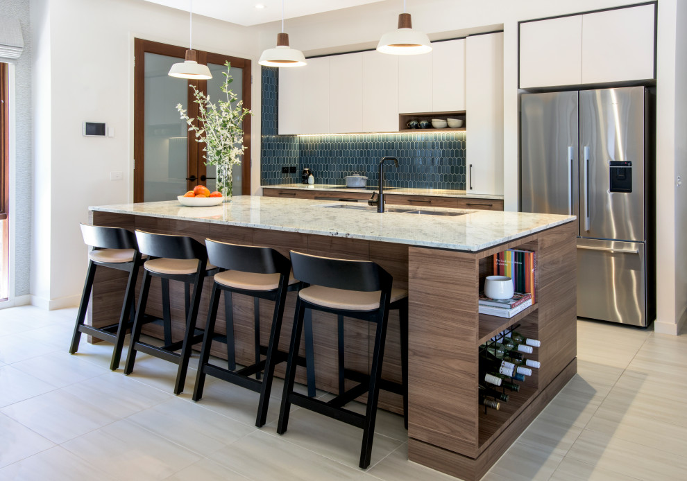 This is an example of a mid-sized contemporary kitchen in Melbourne with an undermount sink, medium wood cabinets, granite benchtops, blue splashback, porcelain splashback, stainless steel appliances, porcelain floors, with island and beige floor.