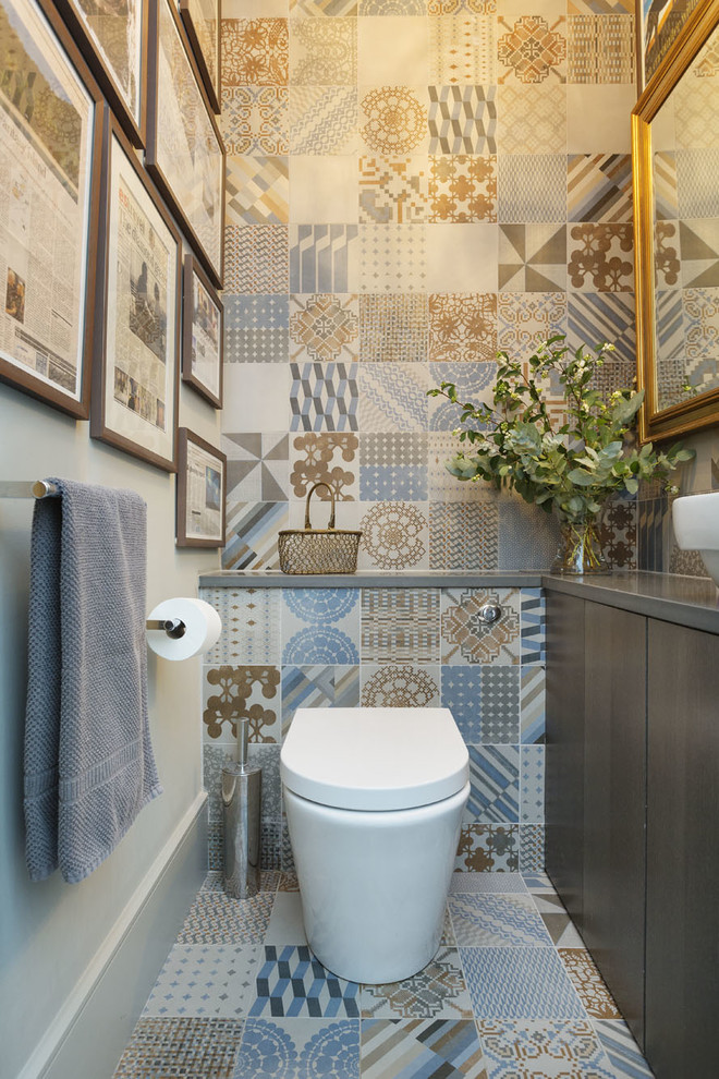 Design ideas for a contemporary cloakroom in London with flat-panel cabinets, dark wood cabinets, a one-piece toilet, grey walls and a vessel sink.