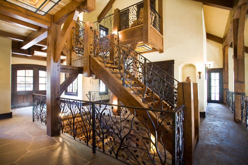 Inspiration for a huge rustic wooden u-shaped open staircase remodel in Denver