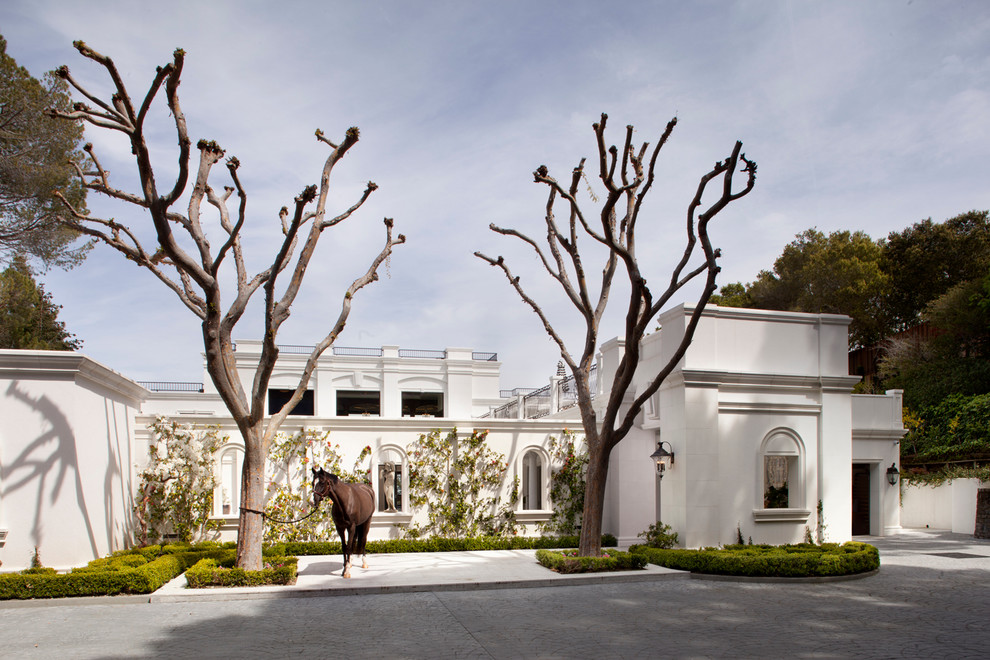 Inspiration for an expansive traditional two-storey concrete white exterior in San Francisco.
