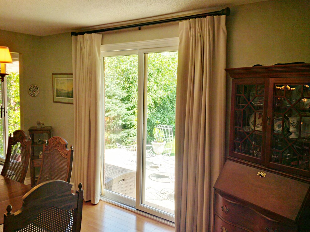Dining room - transitional light wood floor dining room idea in Toronto