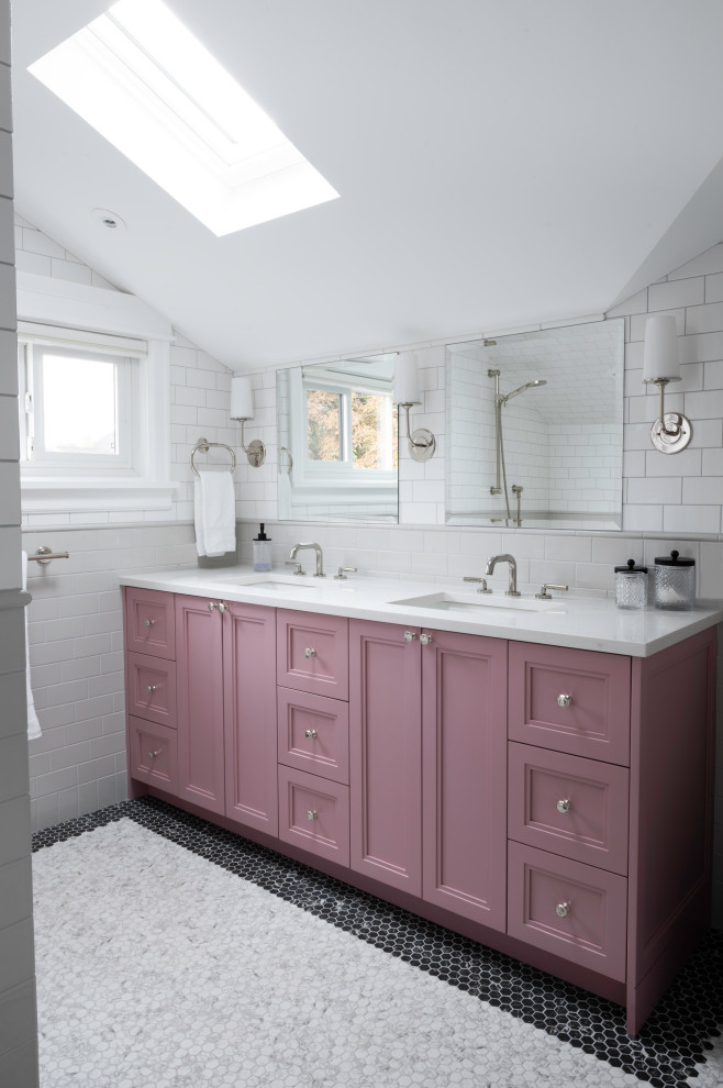 This is an example of a medium sized classic ensuite bathroom in Vancouver with shaker cabinets, red cabinets, an alcove bath, a shower/bath combination, a two-piece toilet, multi-coloured tiles, metro tiles, white walls, mosaic tile flooring, a submerged sink, engineered stone worktops, multi-coloured floors, a shower curtain, white worktops, a wall niche, double sinks, a built in vanity unit and a vaulted ceiling.