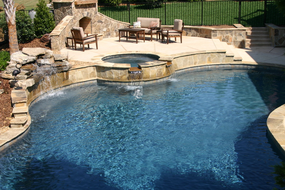 Inspiration for a large rustic backyard concrete paver and custom-shaped lap hot tub remodel in Charlotte