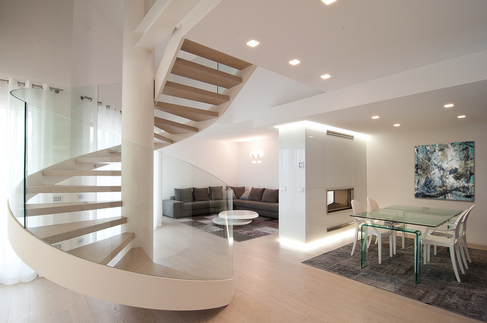 Large contemporary wood spiral staircase in Venice with open risers.