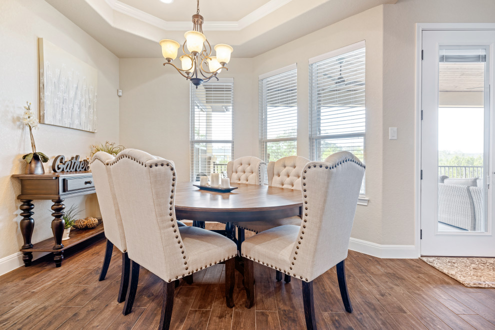 Example of a transitional dining room design in Austin