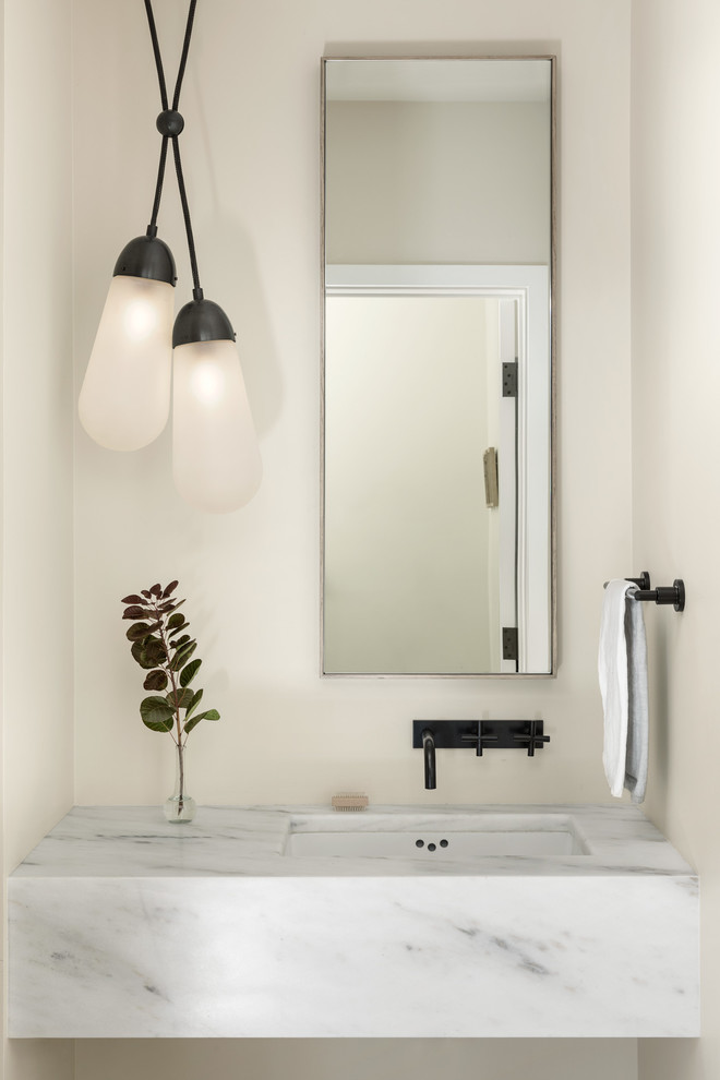 Design ideas for a contemporary powder room in Portland Maine with beige walls and an undermount sink.