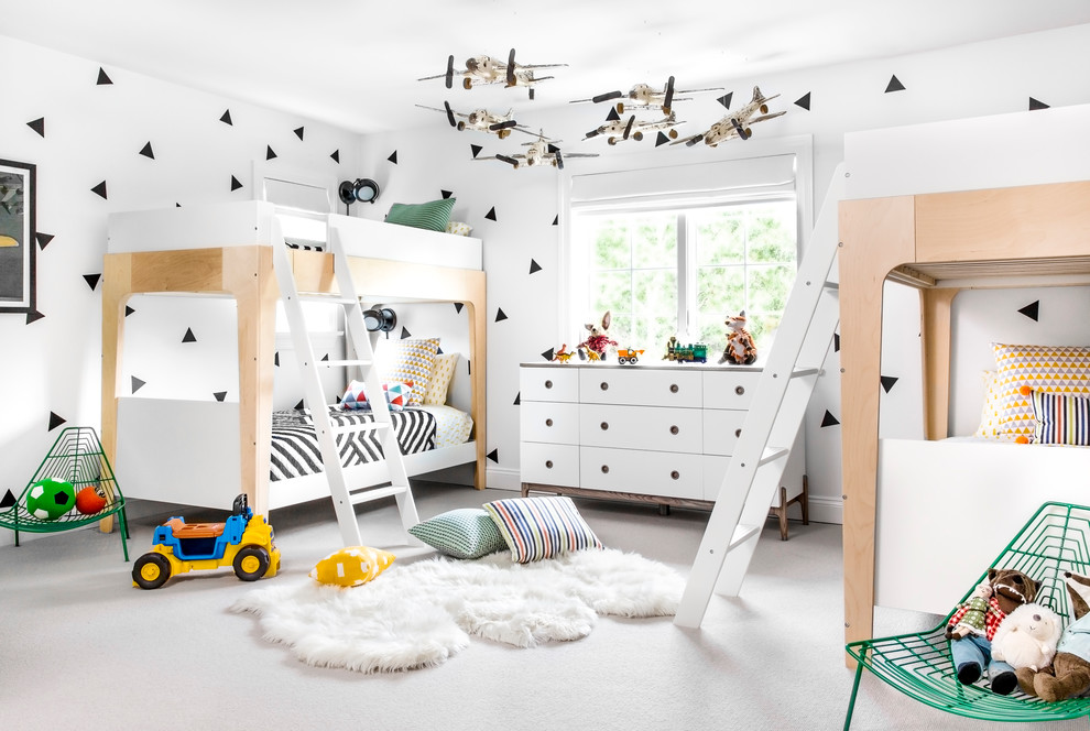 Inspiration for a contemporary gender-neutral kids' room for kids 4-10 years old in New York with white walls and carpet.