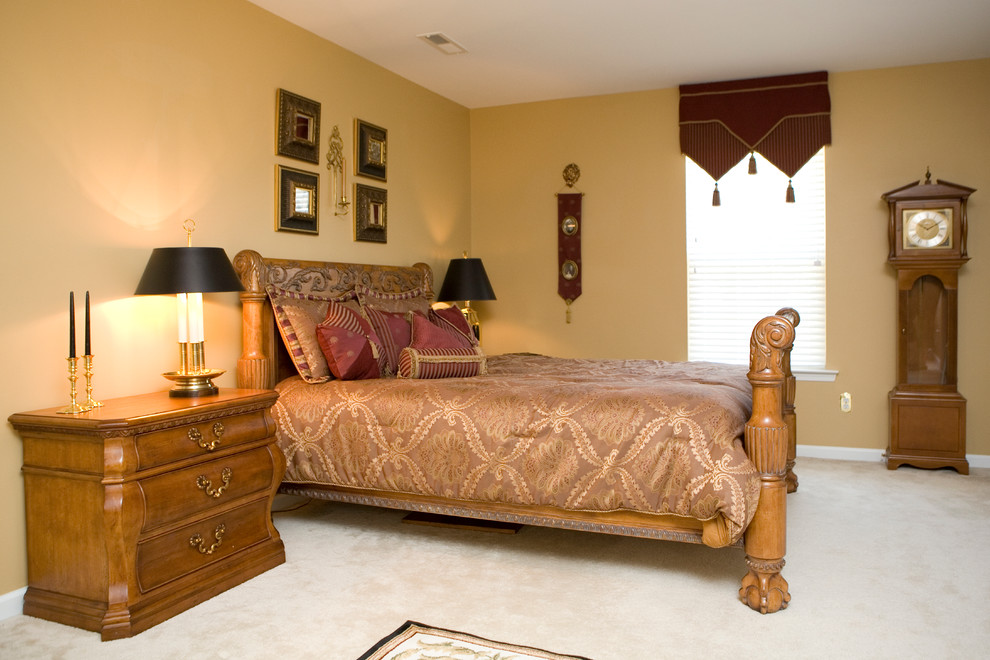 Bedroom - large traditional master carpeted bedroom idea in Other with beige walls and no fireplace