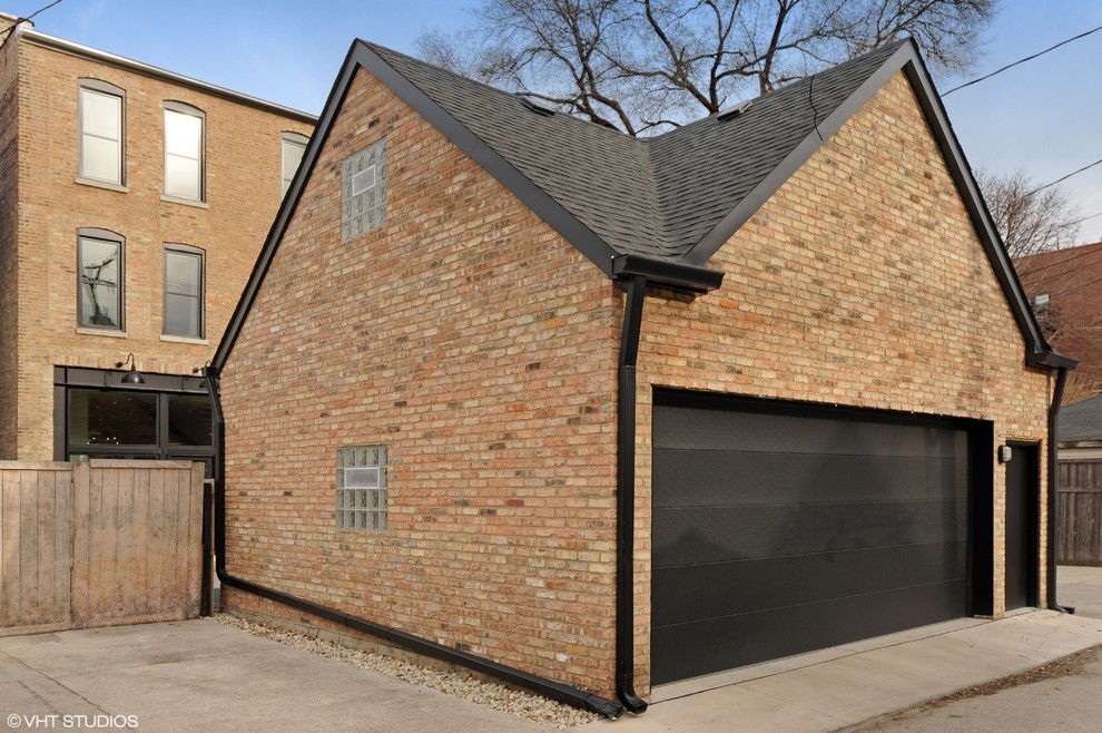 Design ideas for a large modern three-storey brick yellow exterior in Chicago with a flat roof.