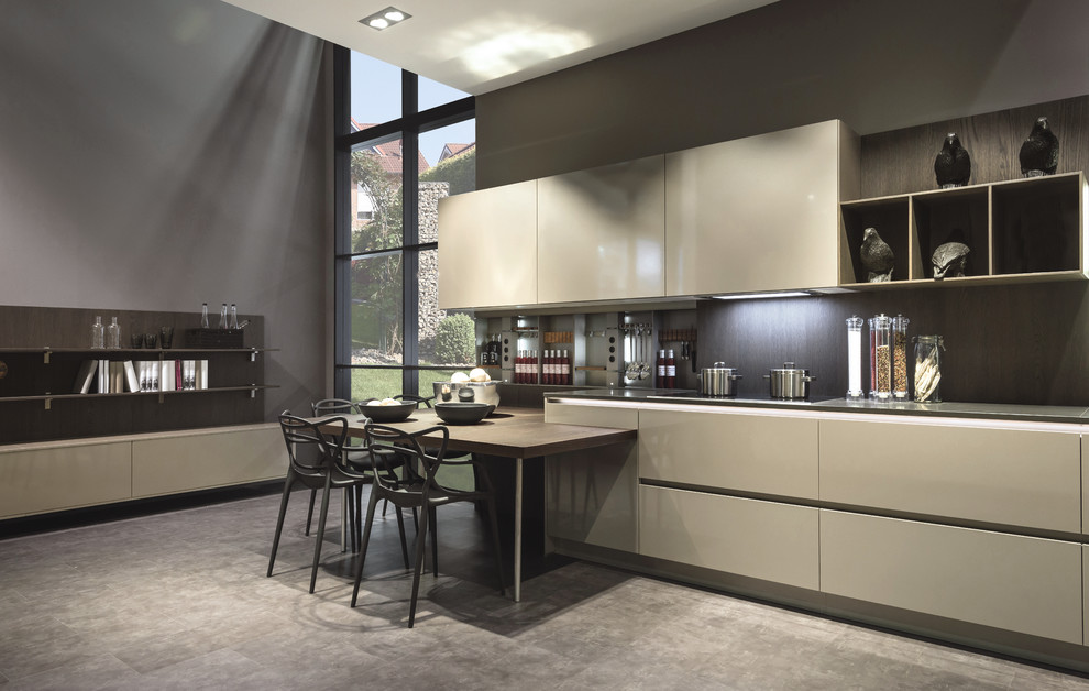 Photo of a contemporary galley eat-in kitchen in Other with flat-panel cabinets, green cabinets, stainless steel benchtops, brown splashback and concrete floors.