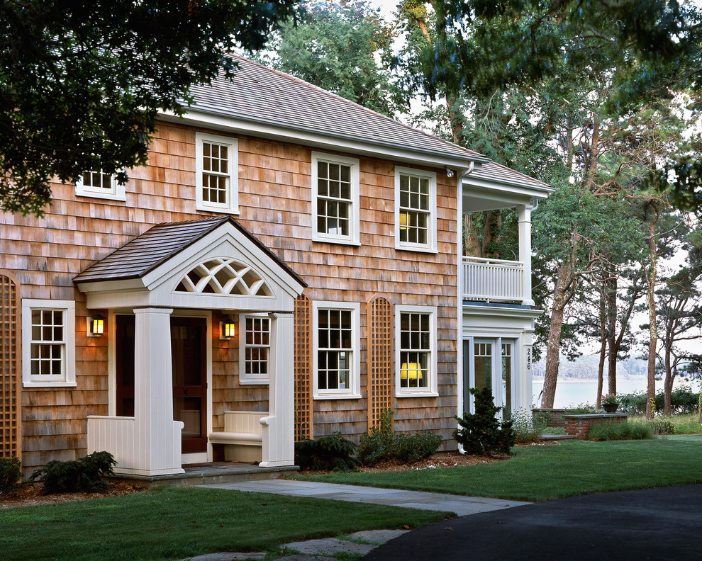 Photo of a traditional two-storey exterior in Boston with wood siding.