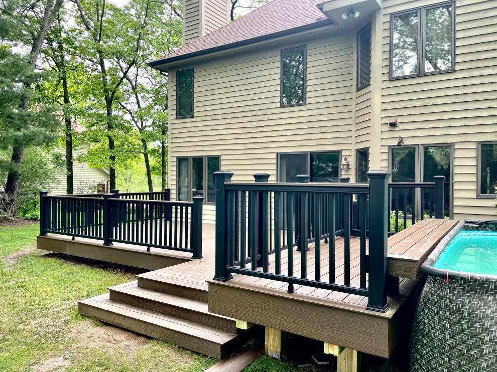 Deck - large backyard ground level deck idea in Chicago