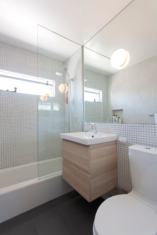 Inspiration for a modern bathroom in Los Angeles with mosaic tile and a shower/bathtub combo.