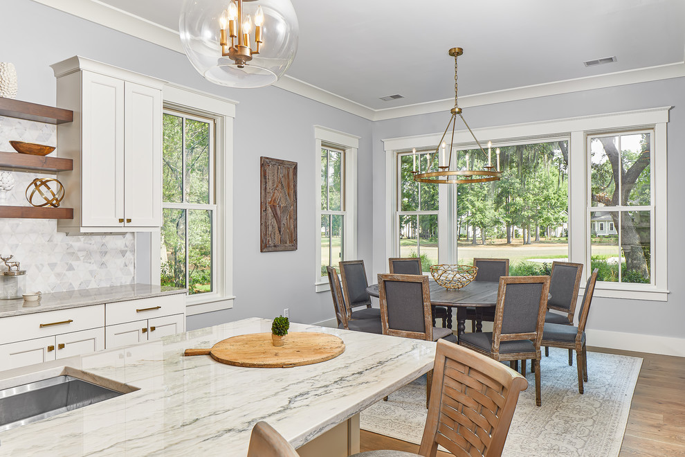 Large beach style medium tone wood floor and brown floor kitchen/dining room combo photo in Charleston with gray walls and no fireplace