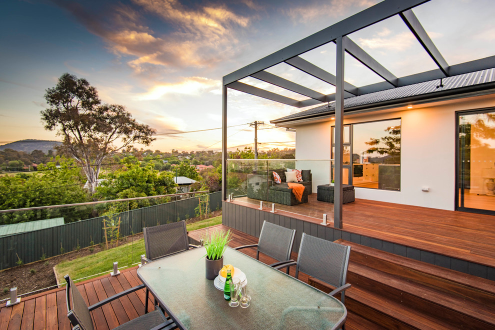Design ideas for a mid-sized beach style backyard deck in Canberra - Queanbeyan.
