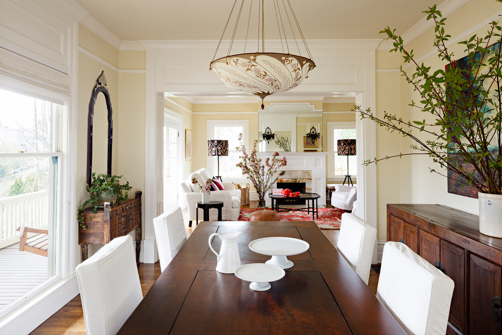 Inspiration for a traditional dining room in Portland with beige walls and dark hardwood floors.