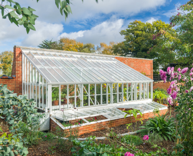 Design ideas for a mid-sized traditional attached greenhouse in Other.