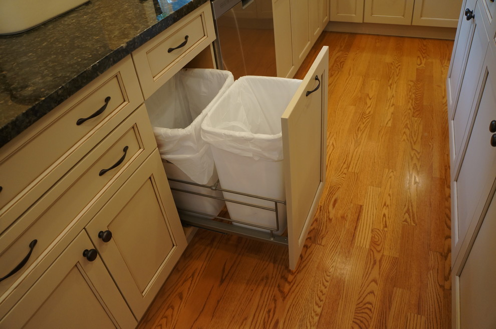 Eat-in kitchen - transitional eat-in kitchen idea in Boston with an undermount sink, recessed-panel cabinets, white cabinets, granite countertops and an island