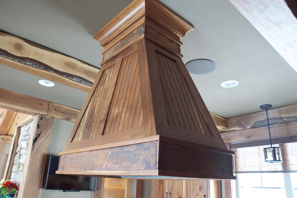 Example of a mountain style eat-in kitchen design in Minneapolis with beaded inset cabinets and medium tone wood cabinets