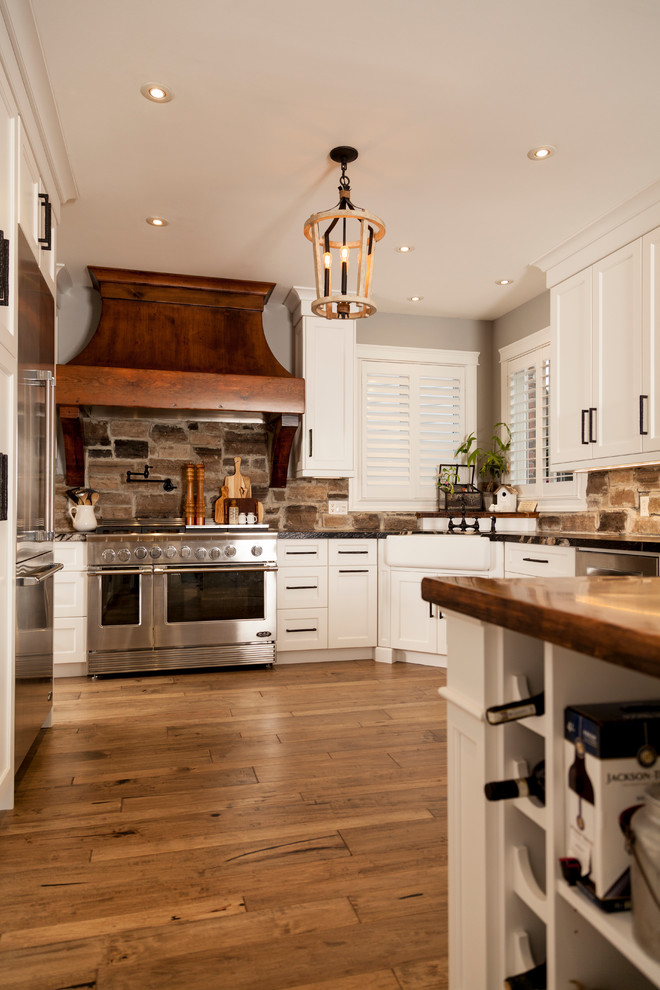 Example of a transitional kitchen design in Toronto