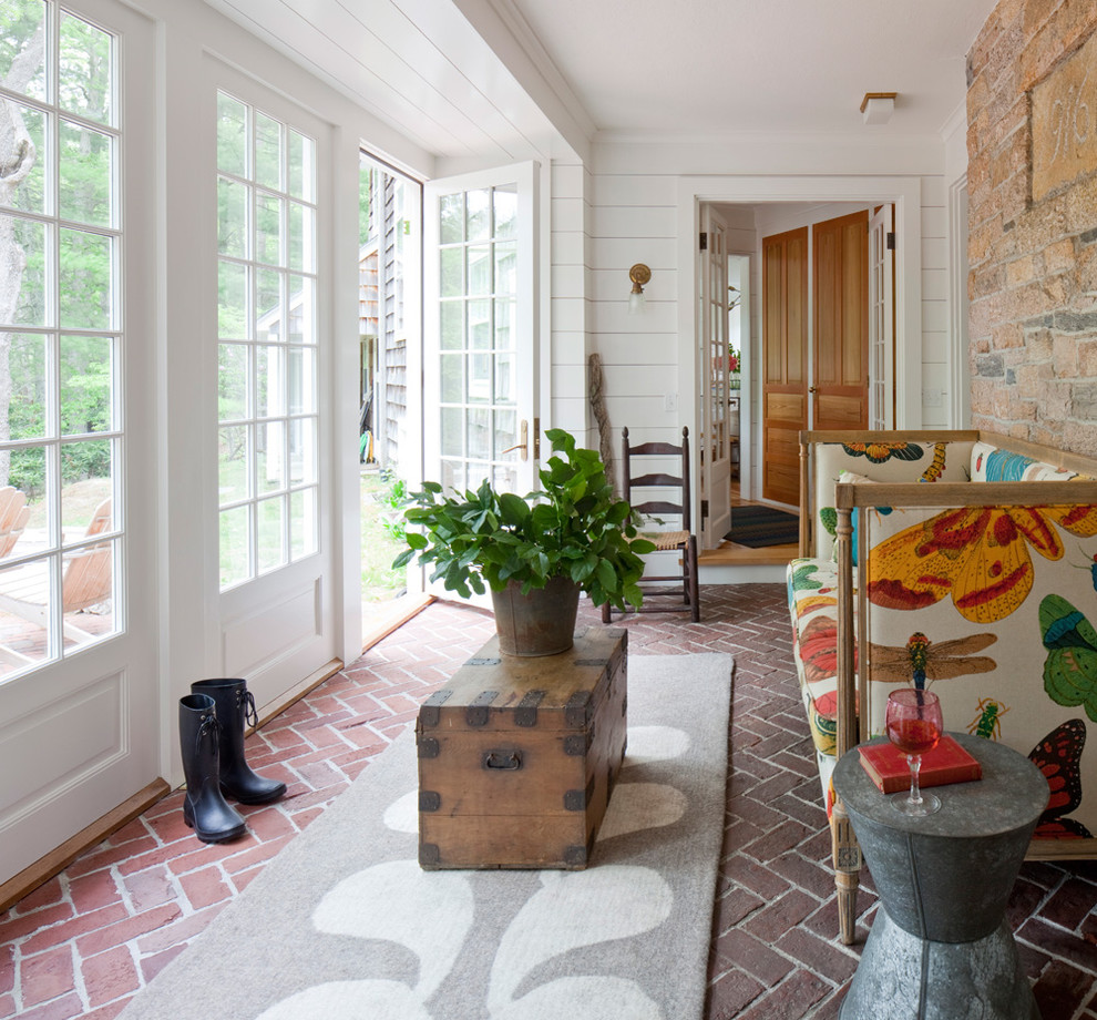 Design ideas for a country sunroom in Providence with brick floors and a standard ceiling.