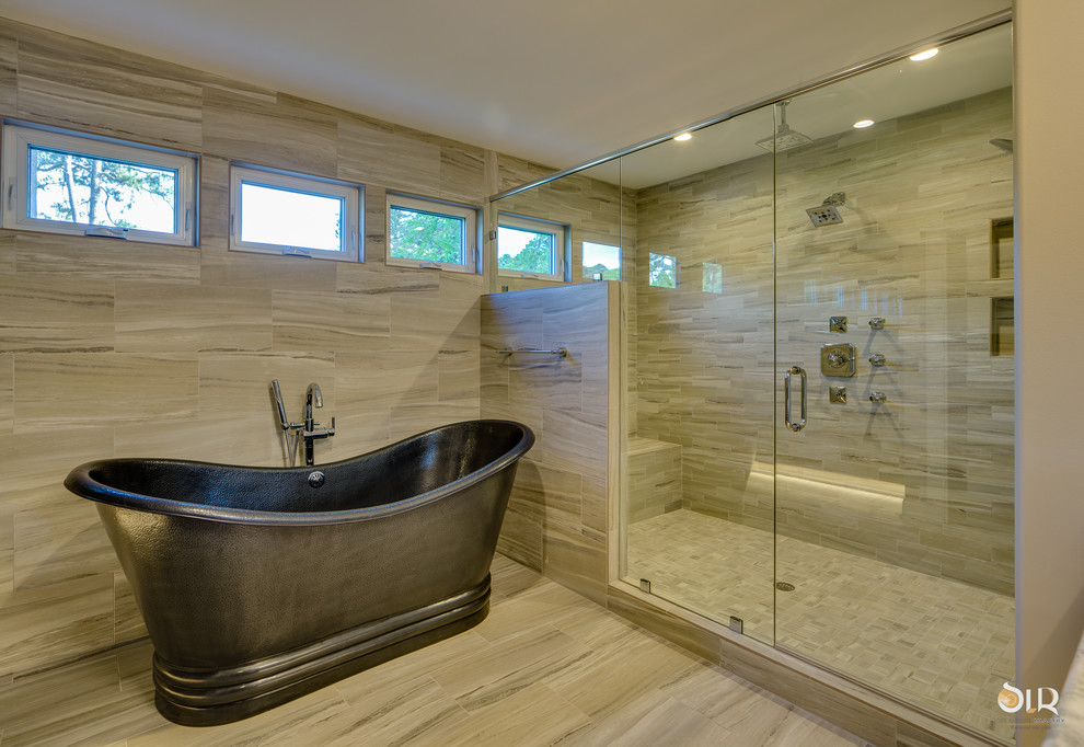 Inspiration for a transitional master dark wood floor and beige floor freestanding bathtub remodel with flat-panel cabinets, light wood cabinets and gray walls
