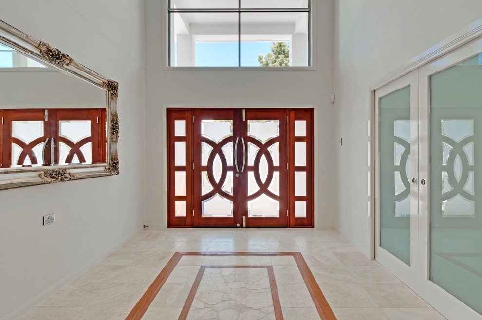 Inspiration for a modern front door in Brisbane with white walls, ceramic floors, a double front door and a medium wood front door.