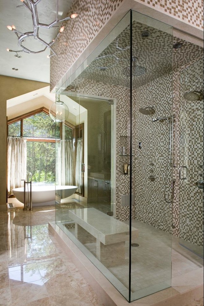 Inspiration for a traditional master bathroom in Denver with a freestanding tub, a double shower, multi-coloured tile and mosaic tile.