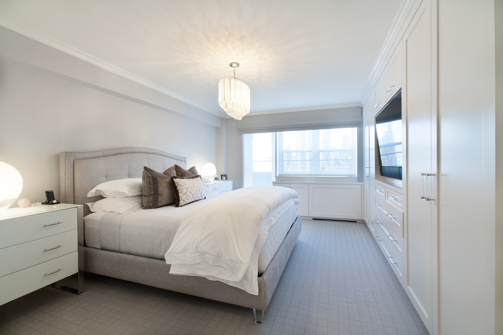 Photo of a mid-sized transitional guest bedroom in New York with white walls, carpet, no fireplace and grey floor.