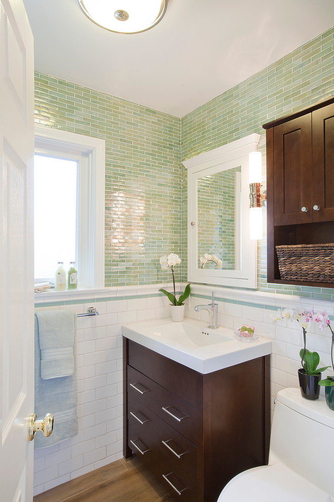 Photo of a contemporary powder room in Los Angeles with glass tile, green tile and white tile.