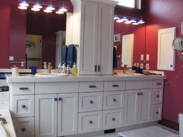 White bathroom vanity with Uneek glass cabinet hardware ...