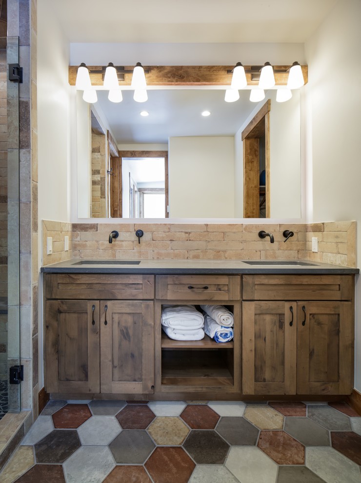 Bathroom - mid-sized rustic 3/4 beige tile and porcelain tile bathroom idea in Denver with shaker cabinets, medium tone wood cabinets, quartz countertops and gray countertops
