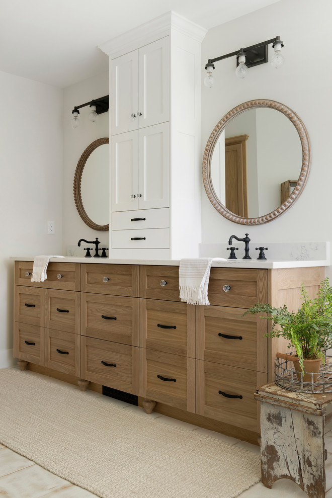 Large modern master bathroom in Minneapolis with beaded inset cabinets, light wood cabinets, a freestanding tub, an open shower, a one-piece toilet, beige walls, painted wood floors, a drop-in sink, white floor, an open shower and white benchtops.
