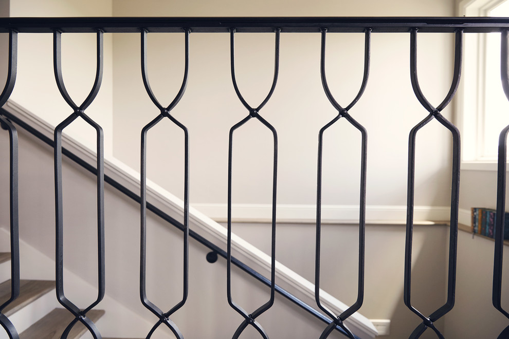 Inspiration for a mid-sized rustic painted l-shaped metal railing staircase remodel with wooden risers