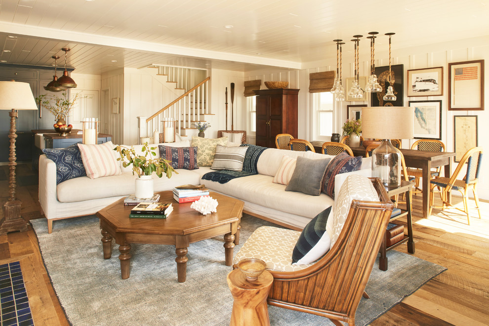 Inspiration for a mid-sized coastal open concept light wood floor living room remodel in Orange County with white walls