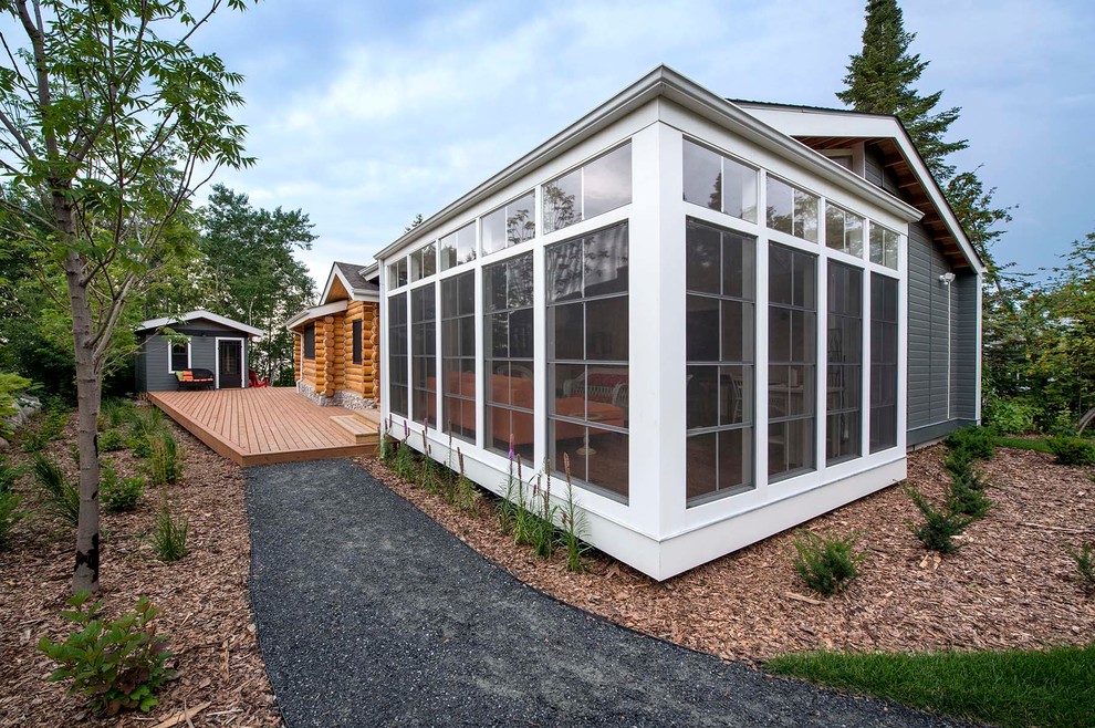 Inspiration for a mid-sized rustic brown one-story mixed siding gable roof remodel with a shingle roof